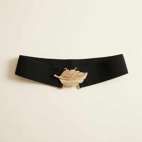 Coralie wide black elastic waist belt with a gold leaf clasp, on a cream studio backdrop