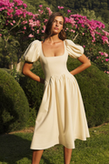 The Scala sand puff-sleeve midi dress in a garden